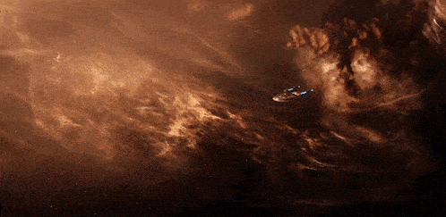 a space ship is flying through a nebula in the outer space