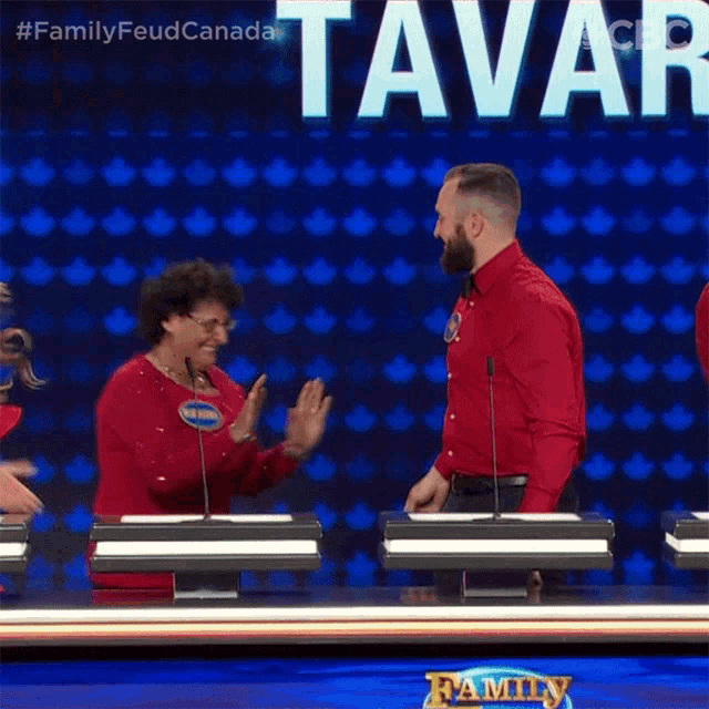 a man hugging a woman on a family feud show