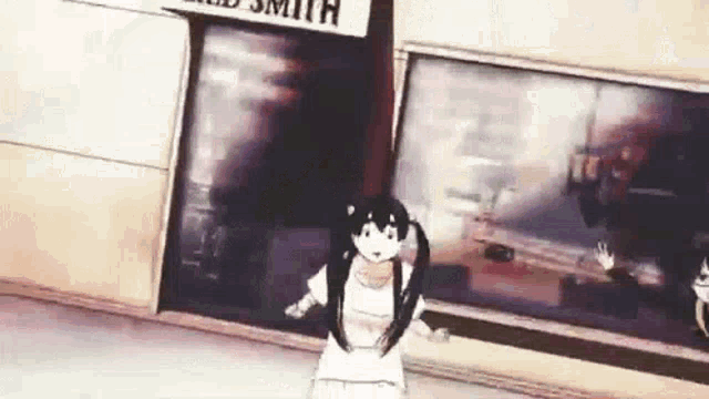 a girl with pigtails is standing in front of a building with a sign on it .