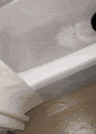 a bathtub with a lot of foam on the floor