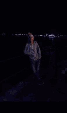 a person 's hands are visible in a dark room