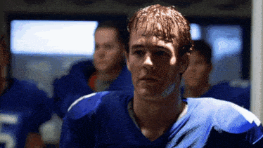 a football player wearing a blue jersey with the number 7 on it