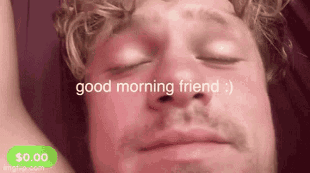 a man is laying in bed with his eyes closed and the words good morning friend written above his face .