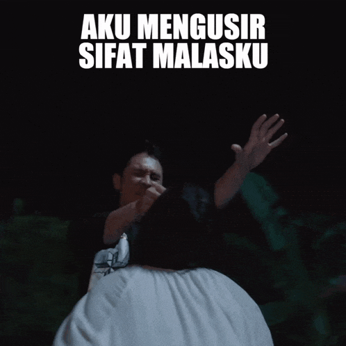 a man in a purple robe holds up his hand in front of a woman with the words aku mengusir sifat malasku above him