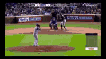 a baseball game is being played on a field with a helly fresh bank banner