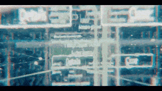 an aerial view of a city with a lot of buildings and roads