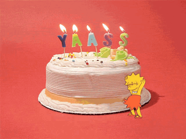 a birthday cake with candles that say yaass on it