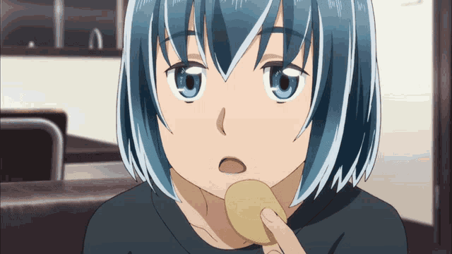 a girl with blue hair is holding a potato chip in her mouth