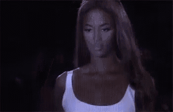 a close up of a person 's butt in a white dress in a dark room .