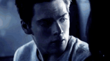 a close up of a man 's face with a serious look on his face