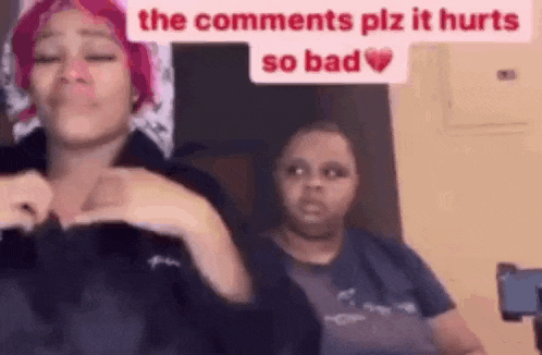 two women are sitting next to each other in a room .