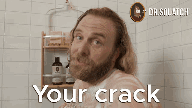 a bearded man in a shower with the words " your crack " above him