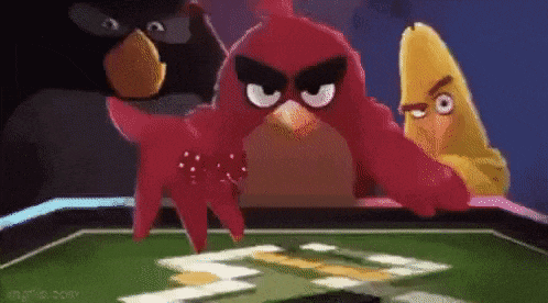 three angry birds are playing a game of cards .