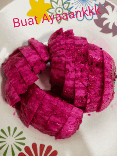 a plate of sliced fruit with the words buat ayaaankkk written on the bottom
