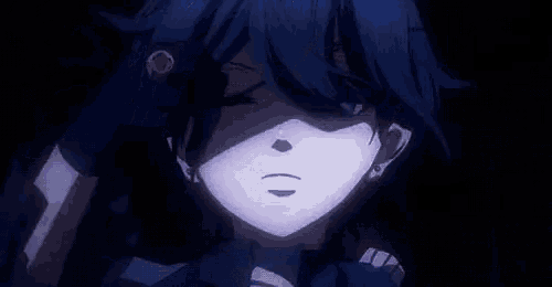 a close up of a person with purple eyes and blue hair .