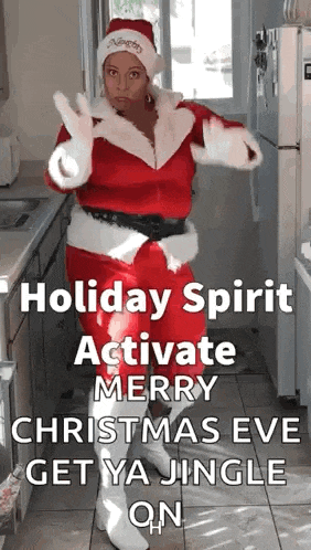a woman dressed as santa claus is dancing in a kitchen