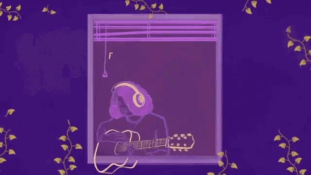 a man is playing a guitar in front of a window with blinds and headphones .