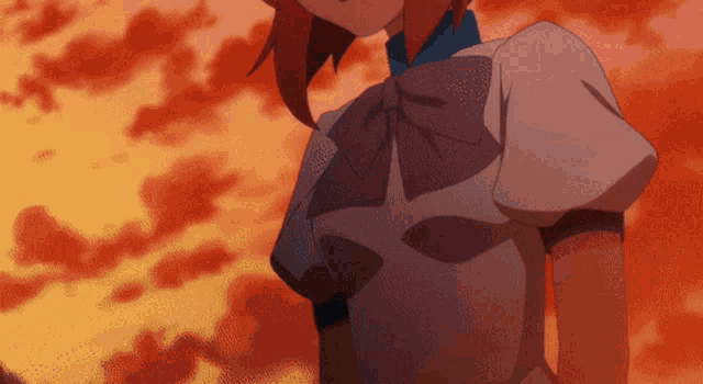 a girl in a white dress with a blue bow on her neck