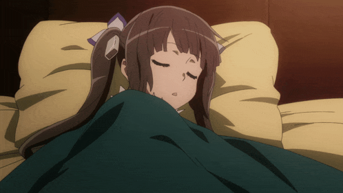 a girl laying in bed with her eyes closed