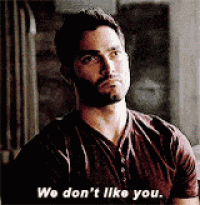 a man with a beard is saying we don t like you .