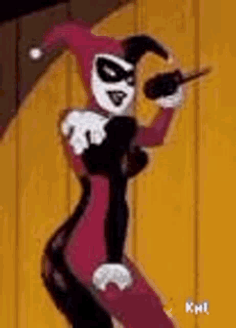 harley quinn from the harley quinn animated series is holding a microphone and dancing .