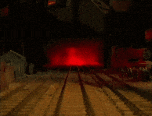 two cartoon trains are on a train track with a red light in the background