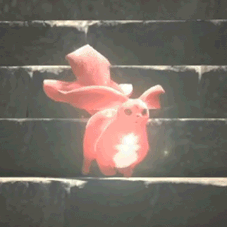 a pink rabbit is sitting on top of a set of stairs with a light coming out of it .