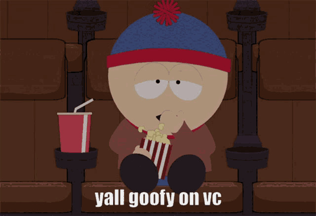 stan marsh from south park sits in a movie theater eating popcorn and drinking soda