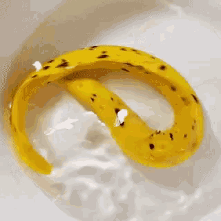 a banana peel is in a bowl of milk