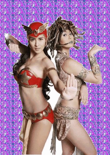 a woman in a red helmet is standing next to a woman in a medusa costume