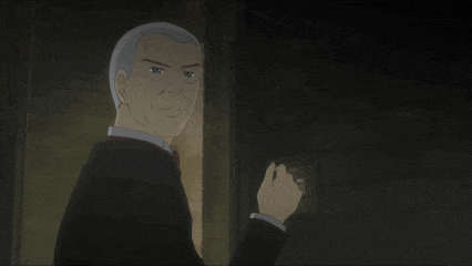 a man in a suit is holding something in his hand in the dark