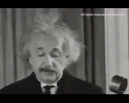 a black and white photo of albert einstein giving a speech