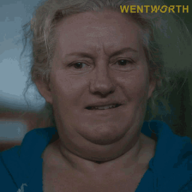 a close up of a woman 's face with the word wentworth on the bottom right