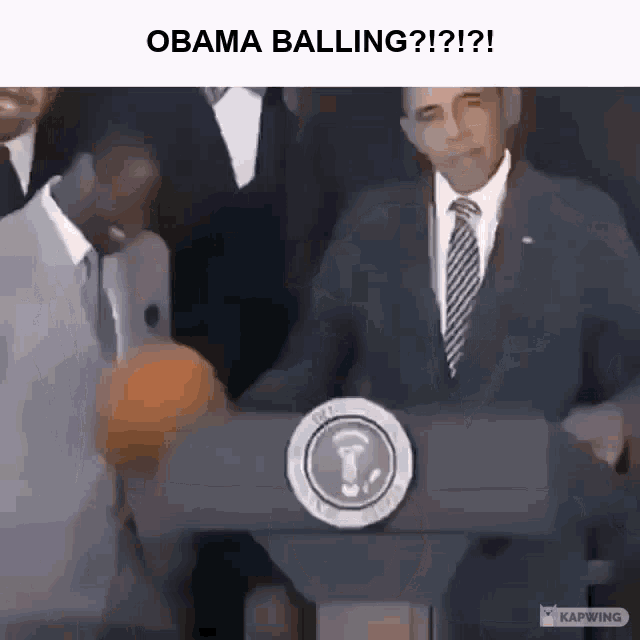 a man in a suit and tie is standing at a podium with a basketball in front of him and the caption obama balling