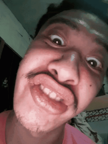 a close up of a man making a funny face