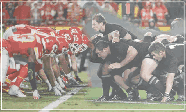 a blurred image of a football game between the chiefs and the blacks