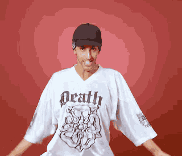 a man is wearing a white shirt that says death