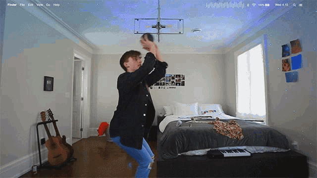 a person is dancing in a bedroom with a keyboard and guitar
