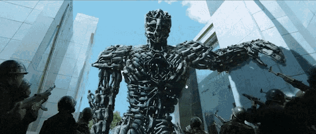 a group of soldiers are standing around a giant robot