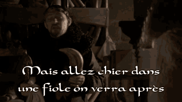 a man is holding a sword and the words mais allez chier dans une fiole on verre apres are above him