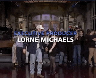 a group of people are dancing on a stage and the executive producer is lorne michaels .