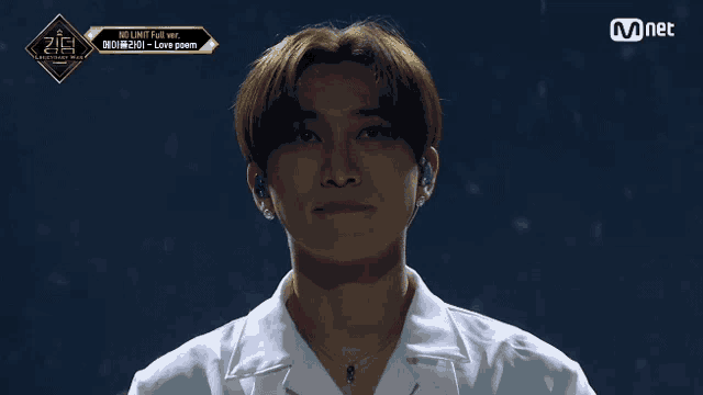 a close up of a person with the word mnet on the bottom