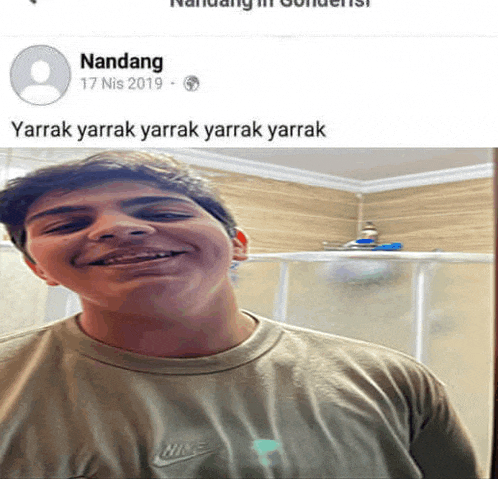 a man wearing a nike shirt is smiling in a facebook post