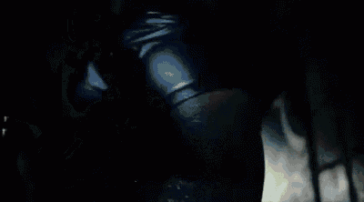 a close up of a woman 's face with tears coming out of her eyes .