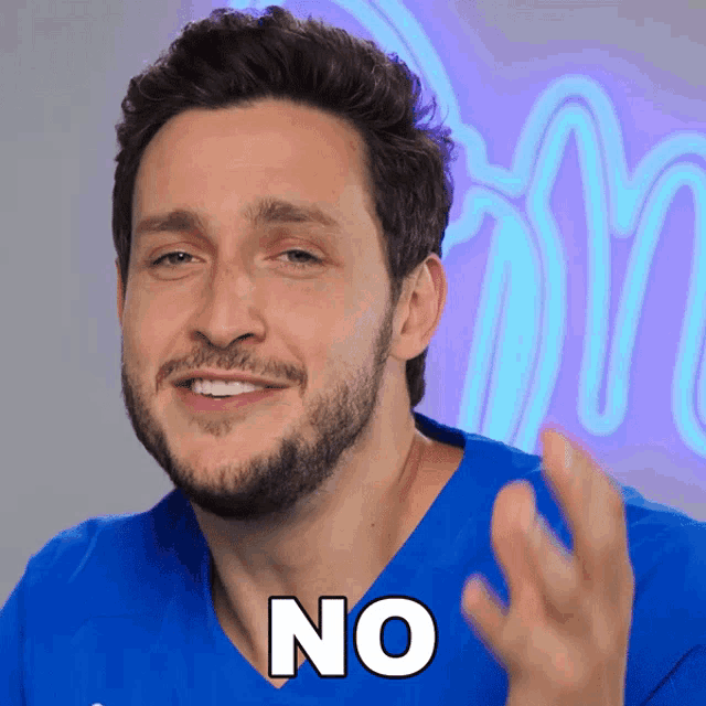 a man in a blue shirt says " no " in white letters