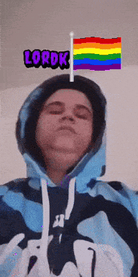 a person wearing a hoodie with a rainbow flag and the word lordk