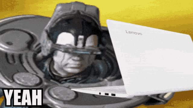 a lenovo laptop is being used by a robotic figure