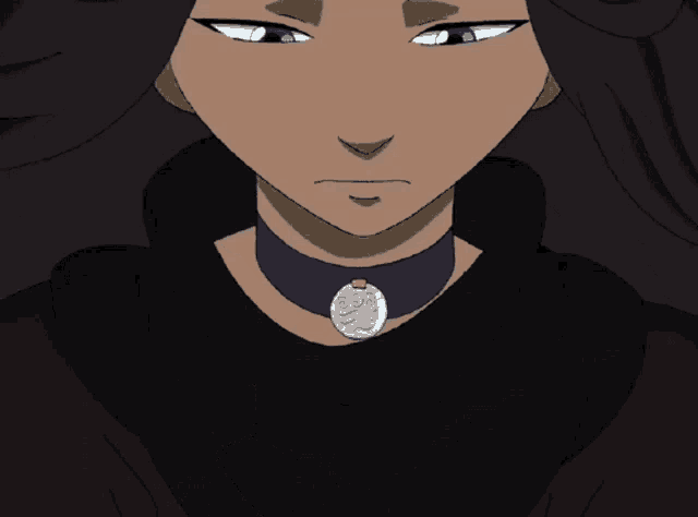 a close up of a person wearing a choker with a blue pendant