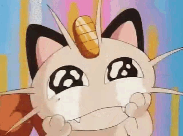a close up of a cartoon cat with a unicorn horn on its head .