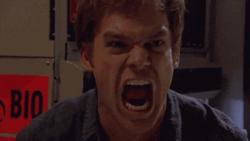 a man is screaming in front of a sign that says bio on it